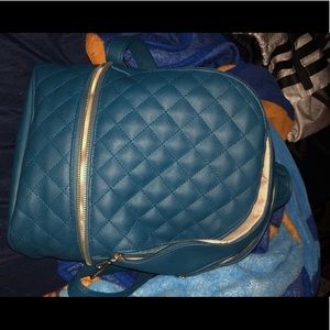 Blue bag no exactly sure the brand but it’s cute